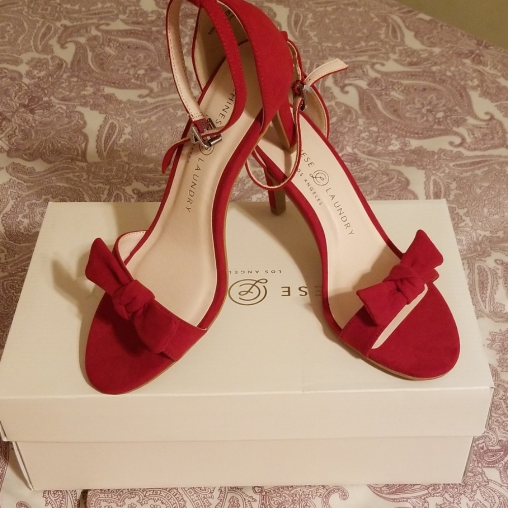Beautiful Red Heels with bow and ankle strap.